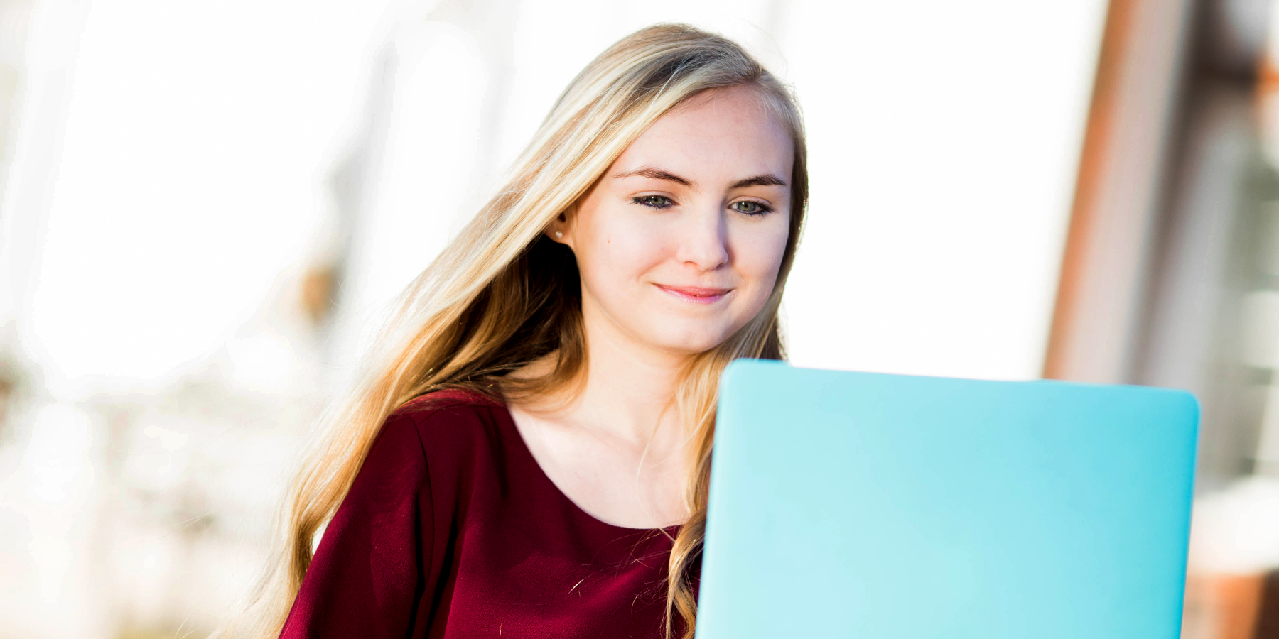 girl sitting outside with her computer