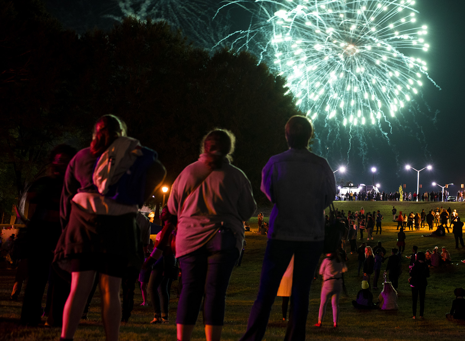 students watching the fireworks from homecoming