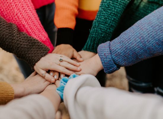 hands stacked for teamwork