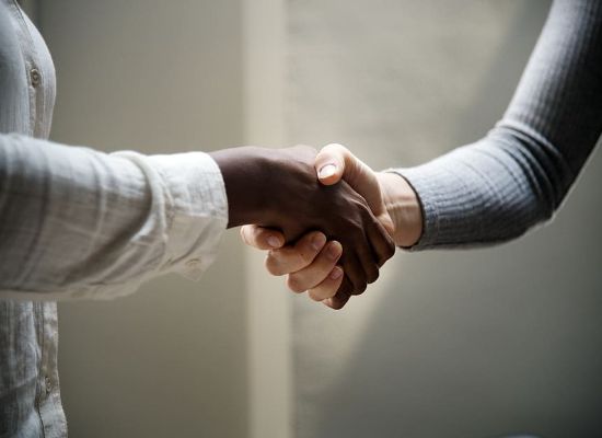 Two people shaking hands
