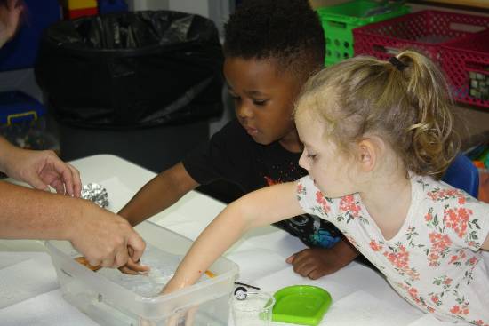 Pre-K Students working on a makerspace activity together