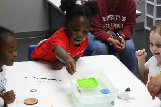 PreK students learning with a makerspace activity.