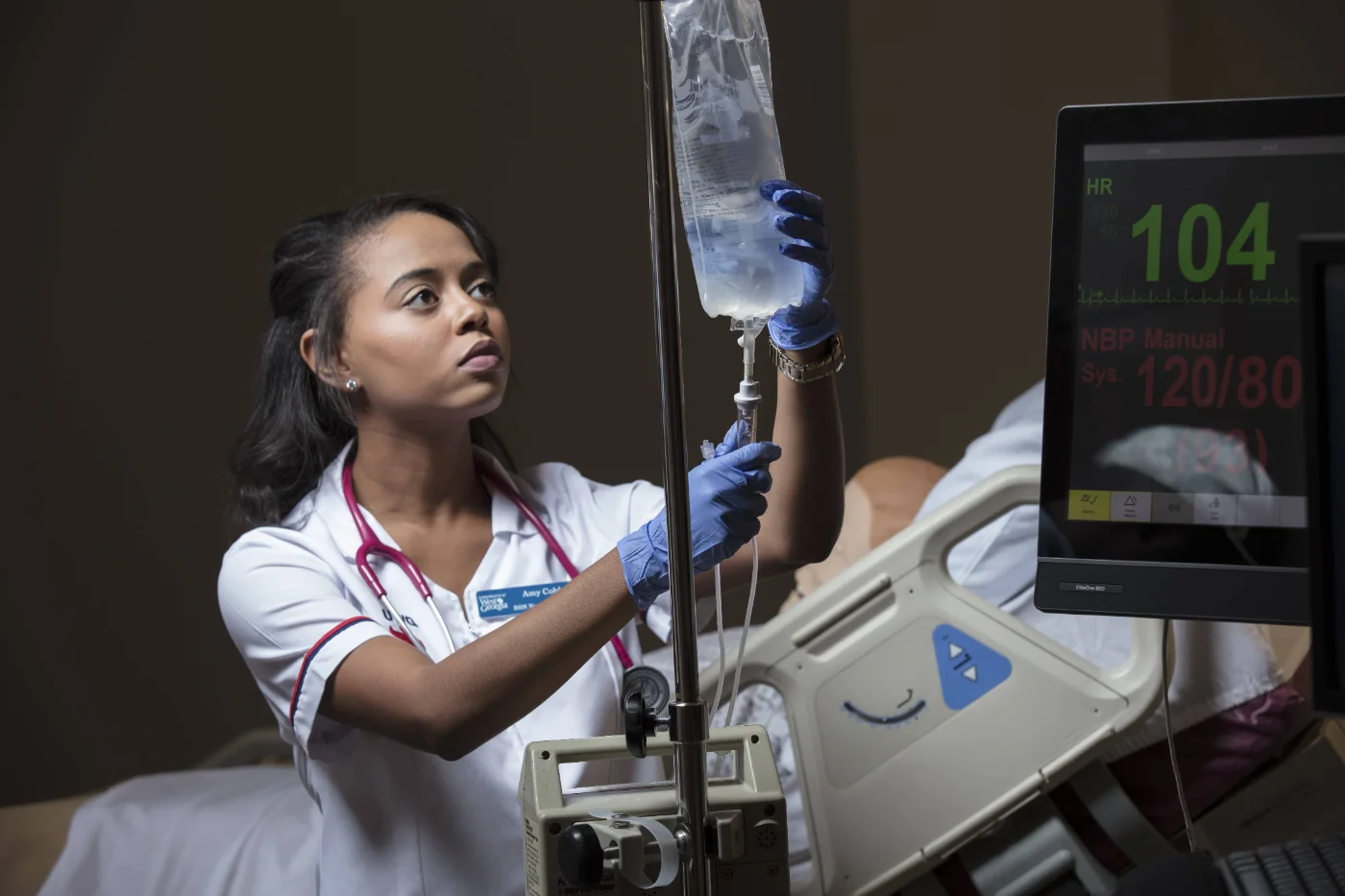 Nursing students checking medical equipment.