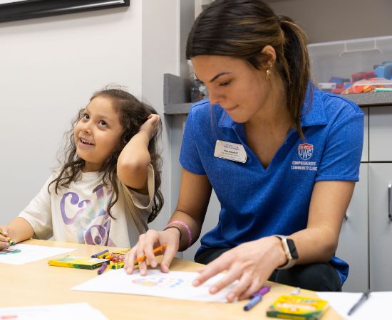 Student coloring with child