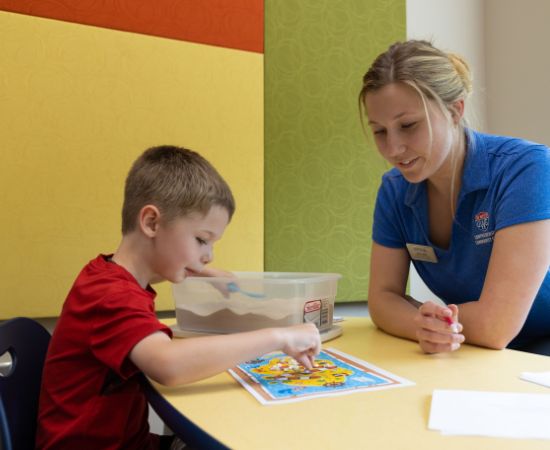 Student working with child