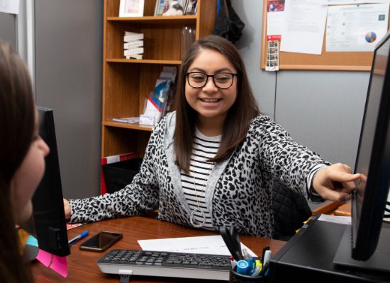 Students sharing a monitor