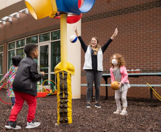 Teacher playing with students