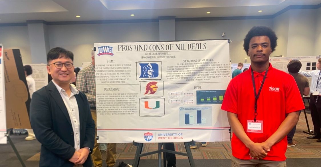 Sport Management Students at UWG Scholars Day with their poster