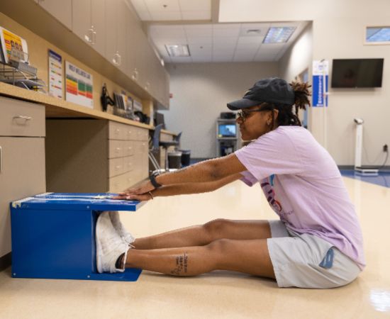 Student testing their flexibility