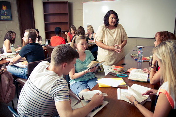 Students writing and reading for class