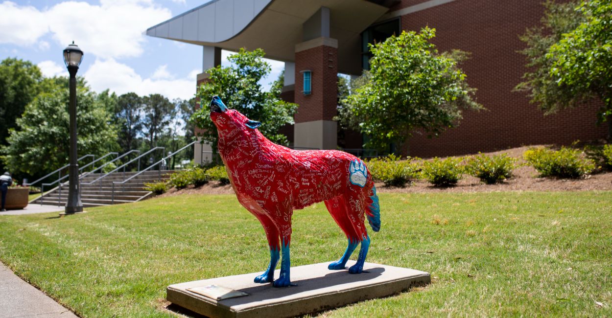 wolf statue on campus