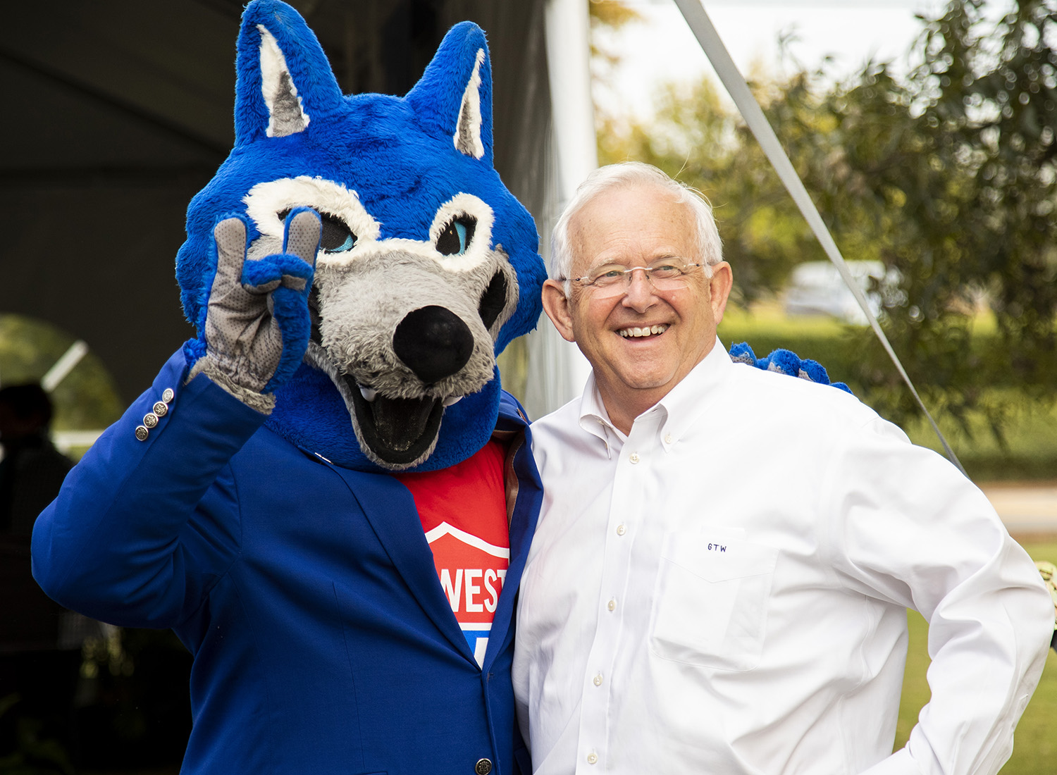 Wolfie with local business owner