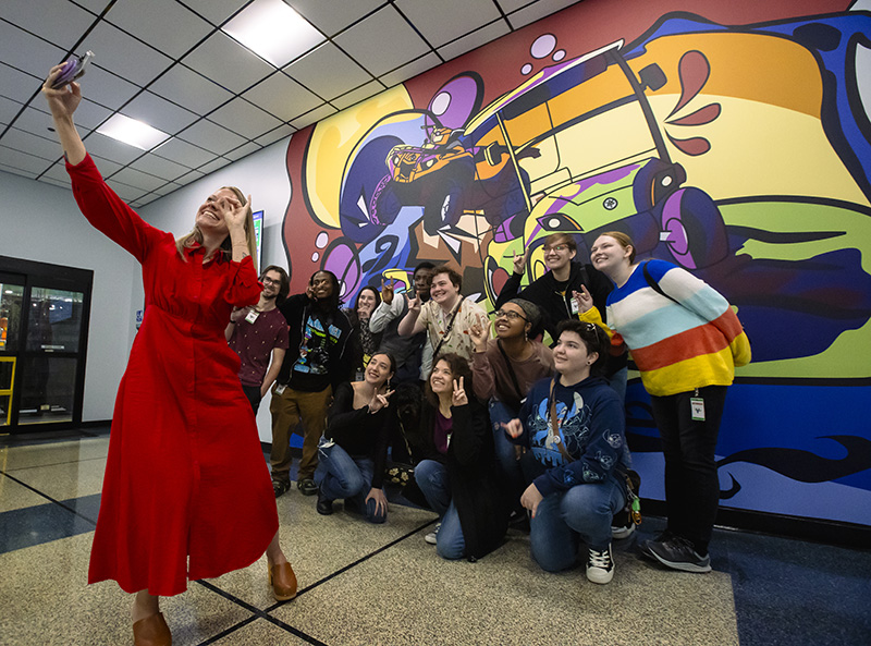 Ribbon cutting and Yamaha in Newnan with UWG students and their mural