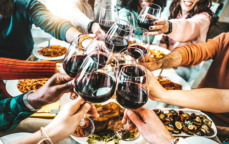 people toasting with wine