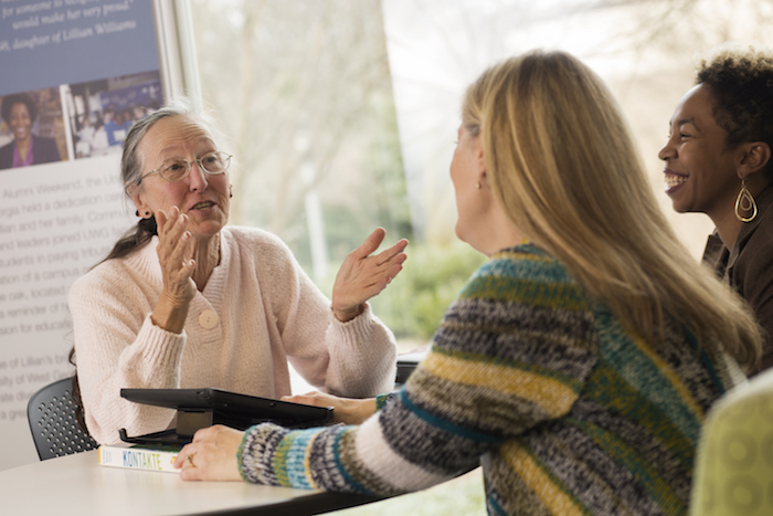 students talking to a counselor