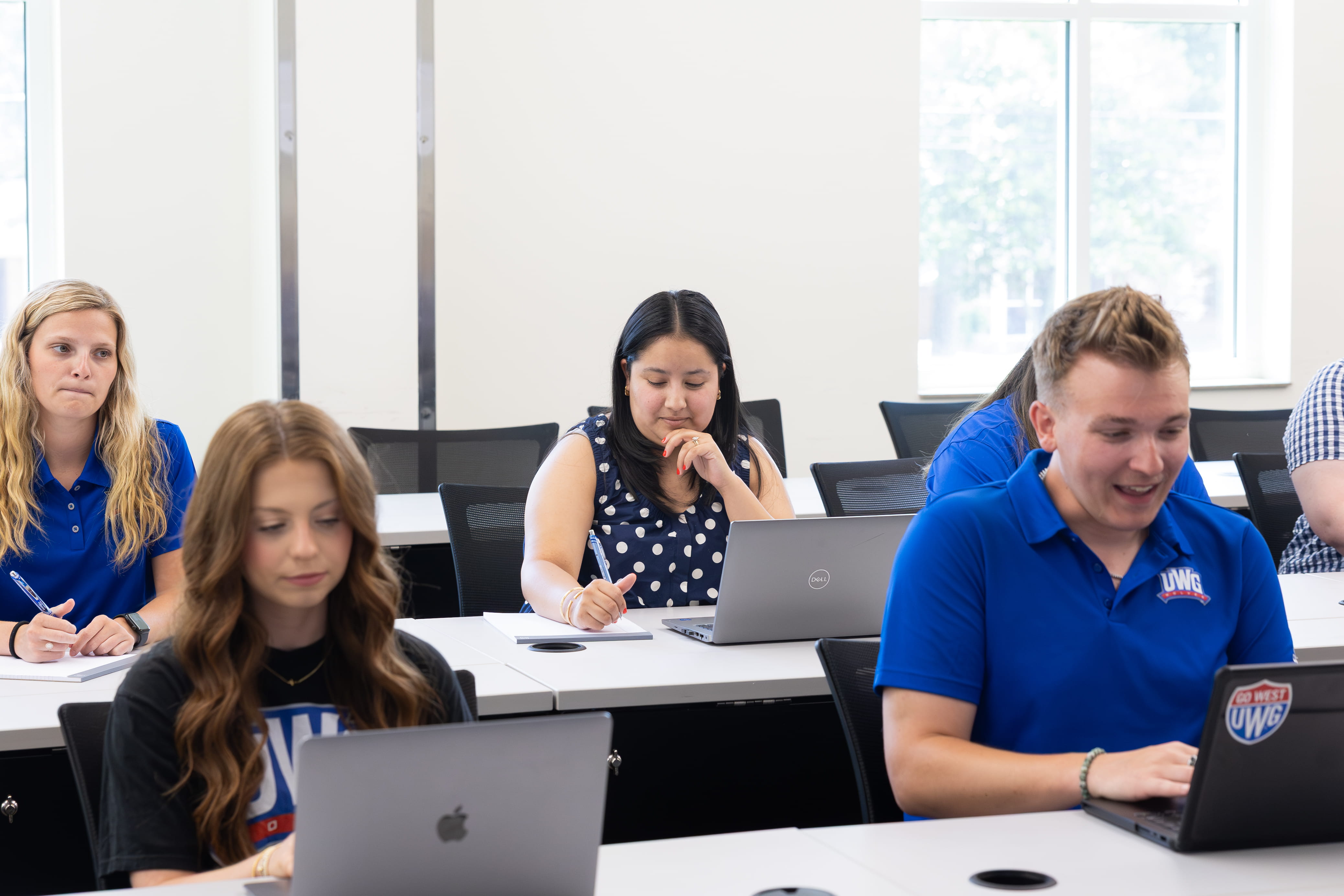 Classroom of students paying attention to the board