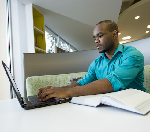 student working on a laptop