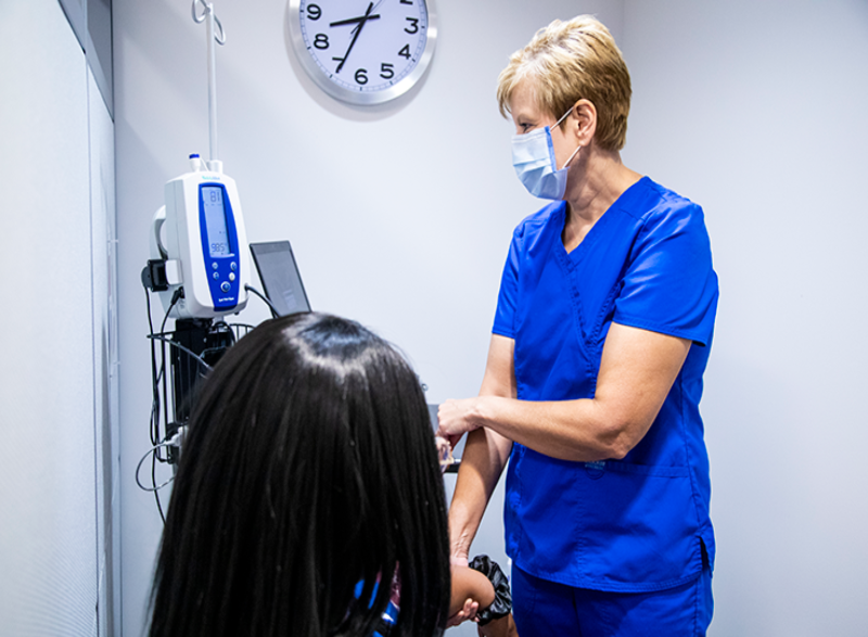 Nurse checking vitals of a patient