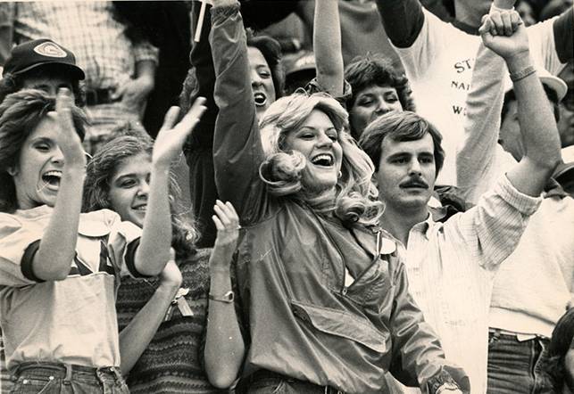 fans cheering at sporting event