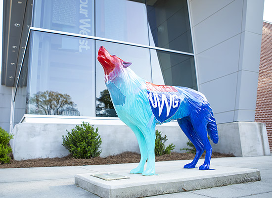 wolf statue in front of Admissions building