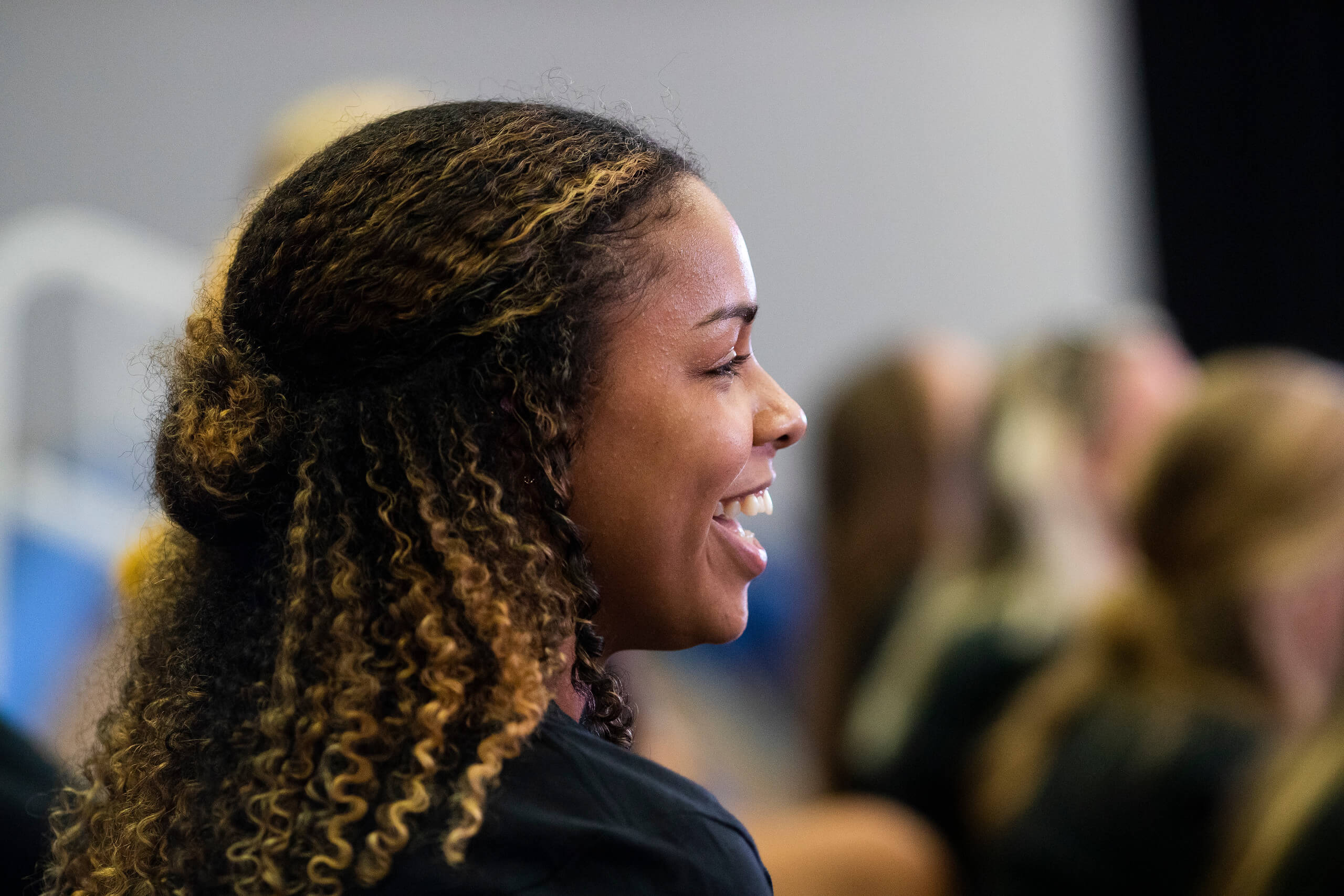 female student smiling outside