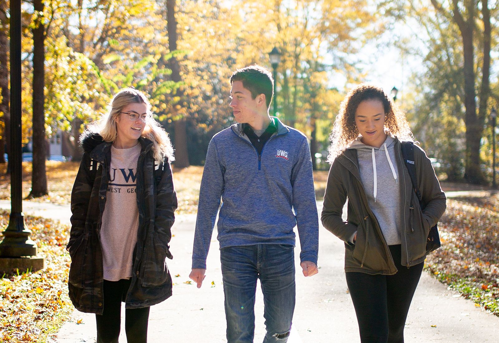 Three UWG students walking outside.
