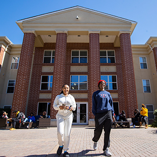 Students walking in front of Arbor View. 