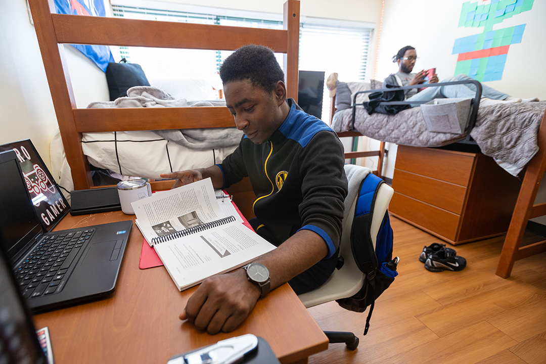 Roommates doing school work in room