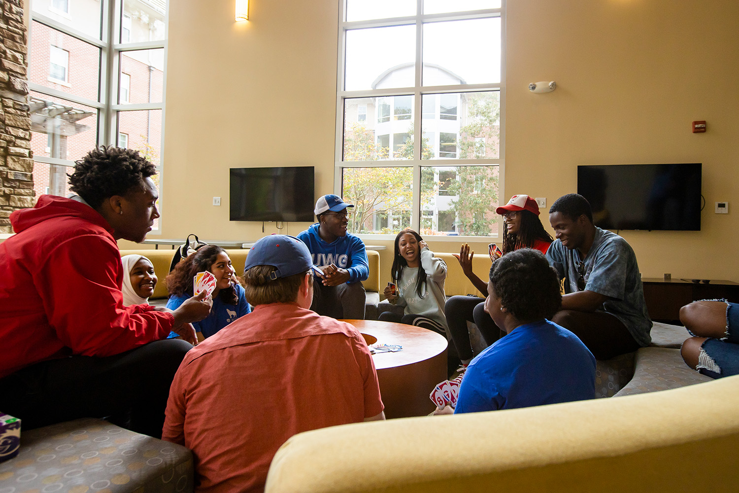 Two students in a residence hall room.