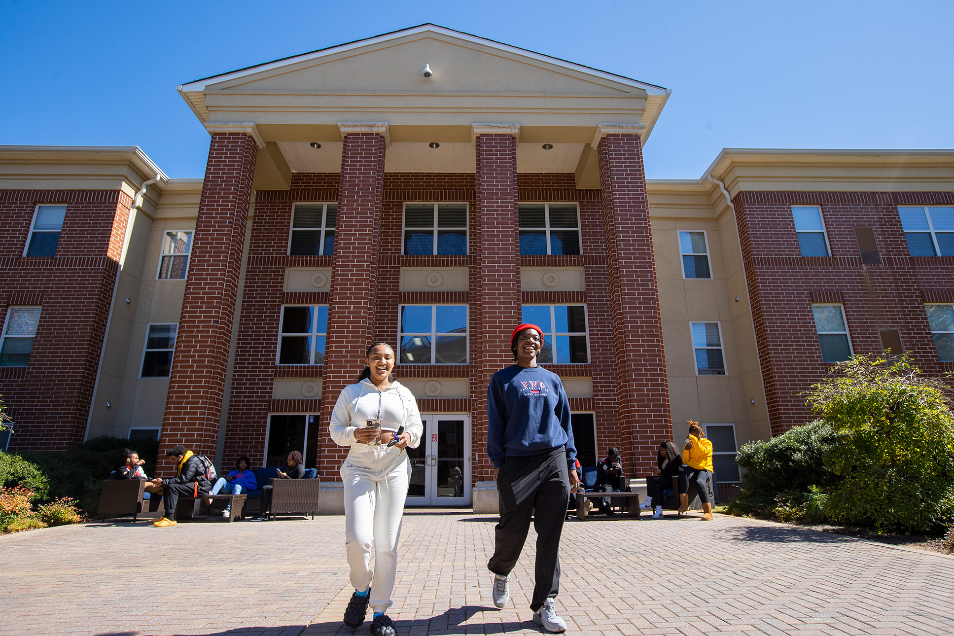 Students walking out of residence hall