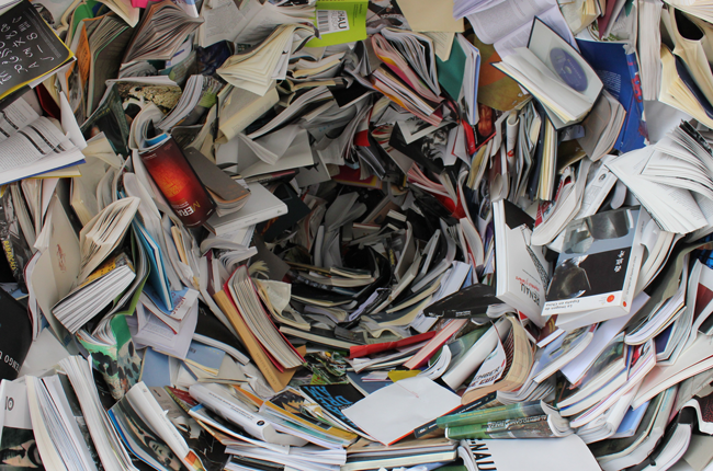 Photography of a pile of books creating the illusion of a whirlpool