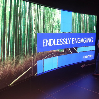 Photograph of a large screen of a picture of bamboo with the words endlessly engaging displayed