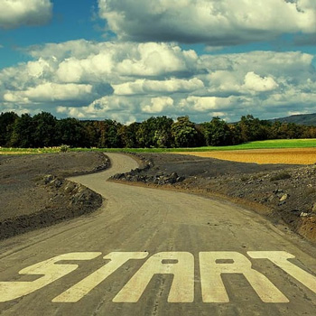 Photograph of a winding road with the word start at the bottom of the image