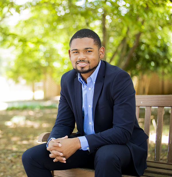 student on campus in business attire