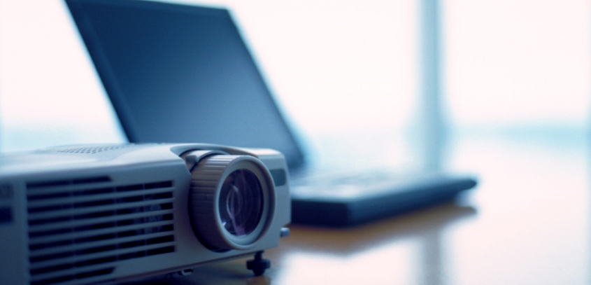 Projector equipment on table.