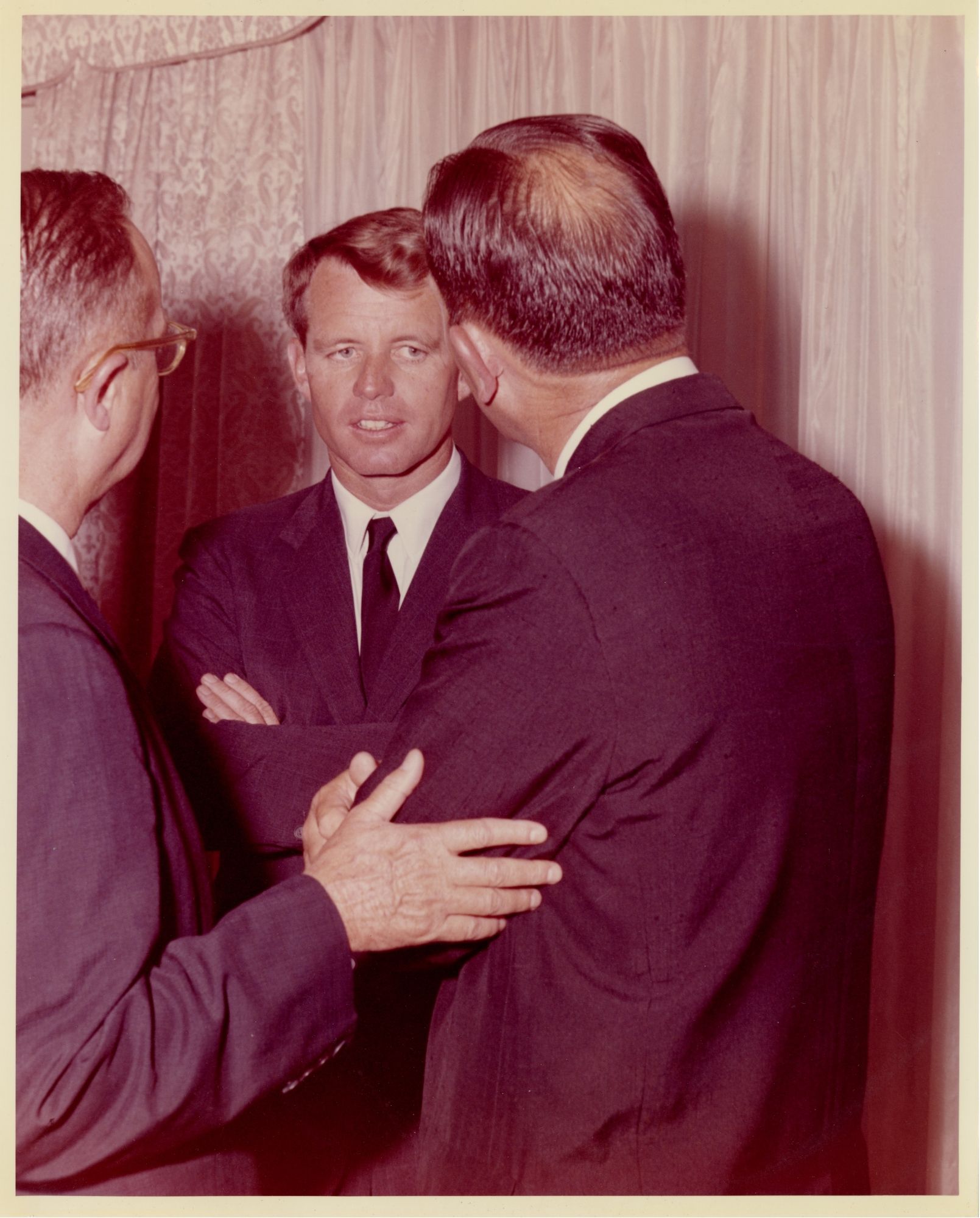 Robert Kennedy being introduced to another man by Dr. Boyd