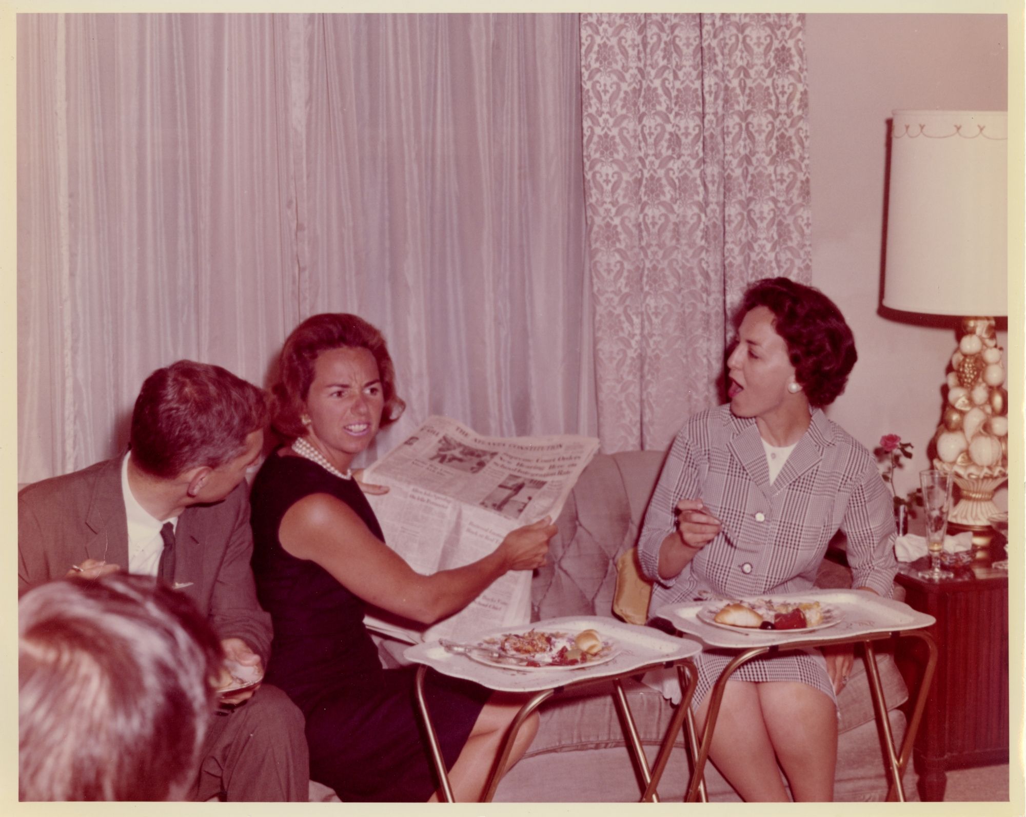 Ethel Kennedy reading The Atlanta Constitution at lunch