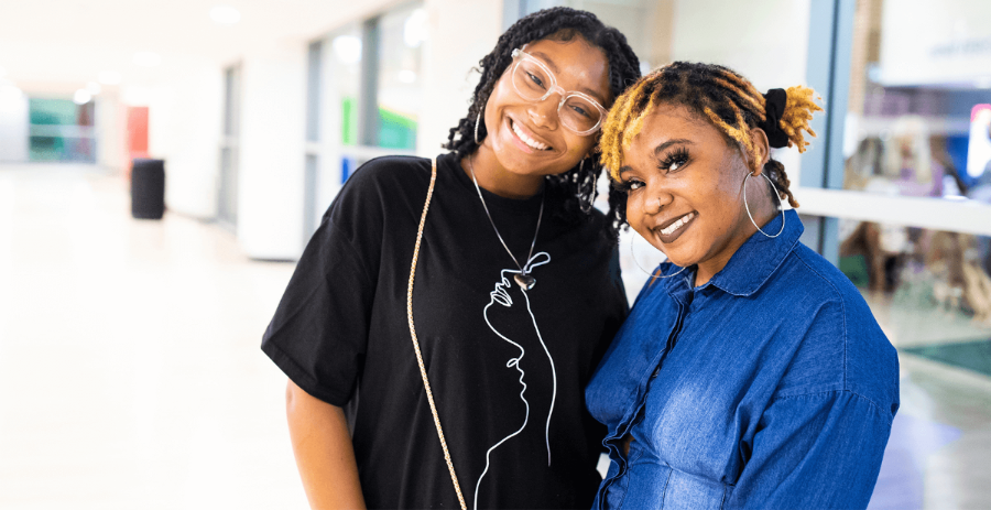 two female students smiling