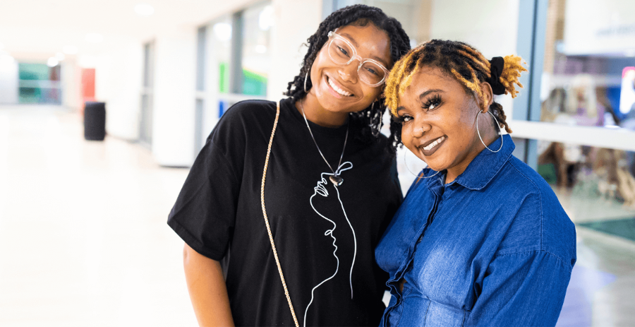 two female students smiling 