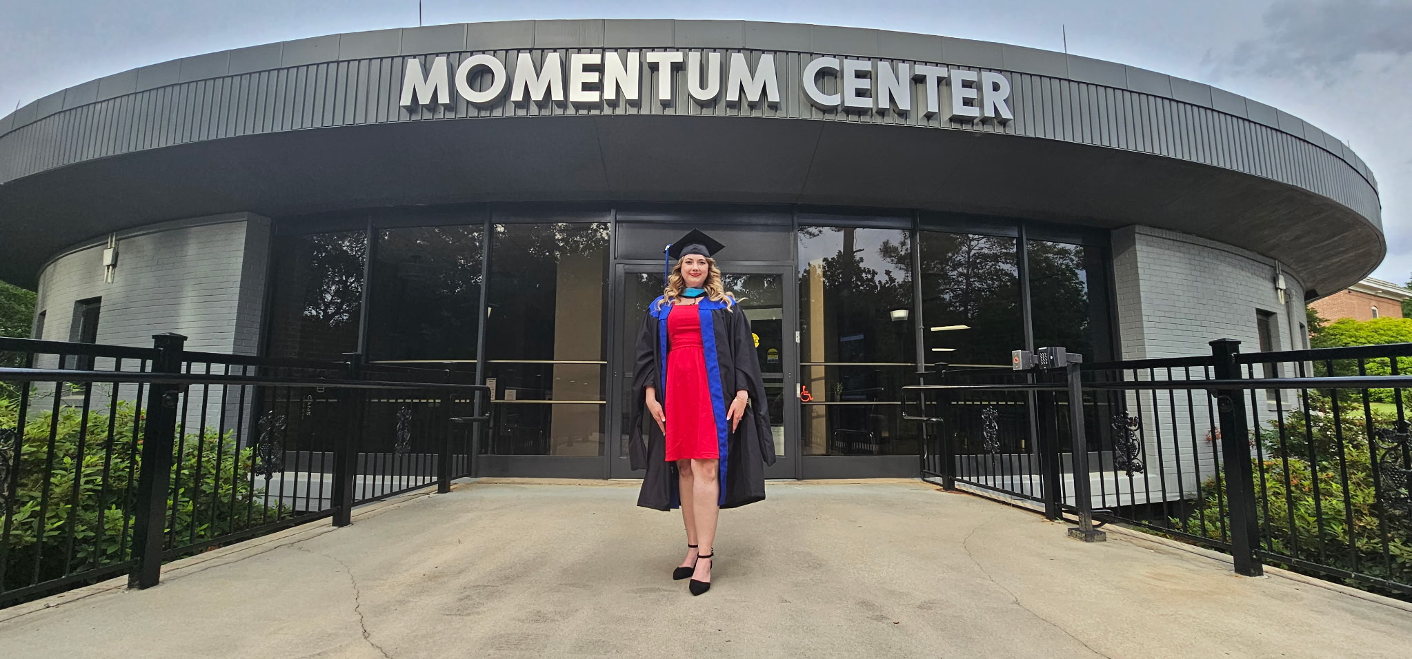 Graduating student in front of MC