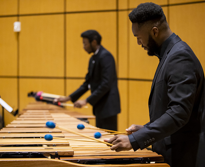 student playing instrument