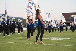 Colorguard and band on field.