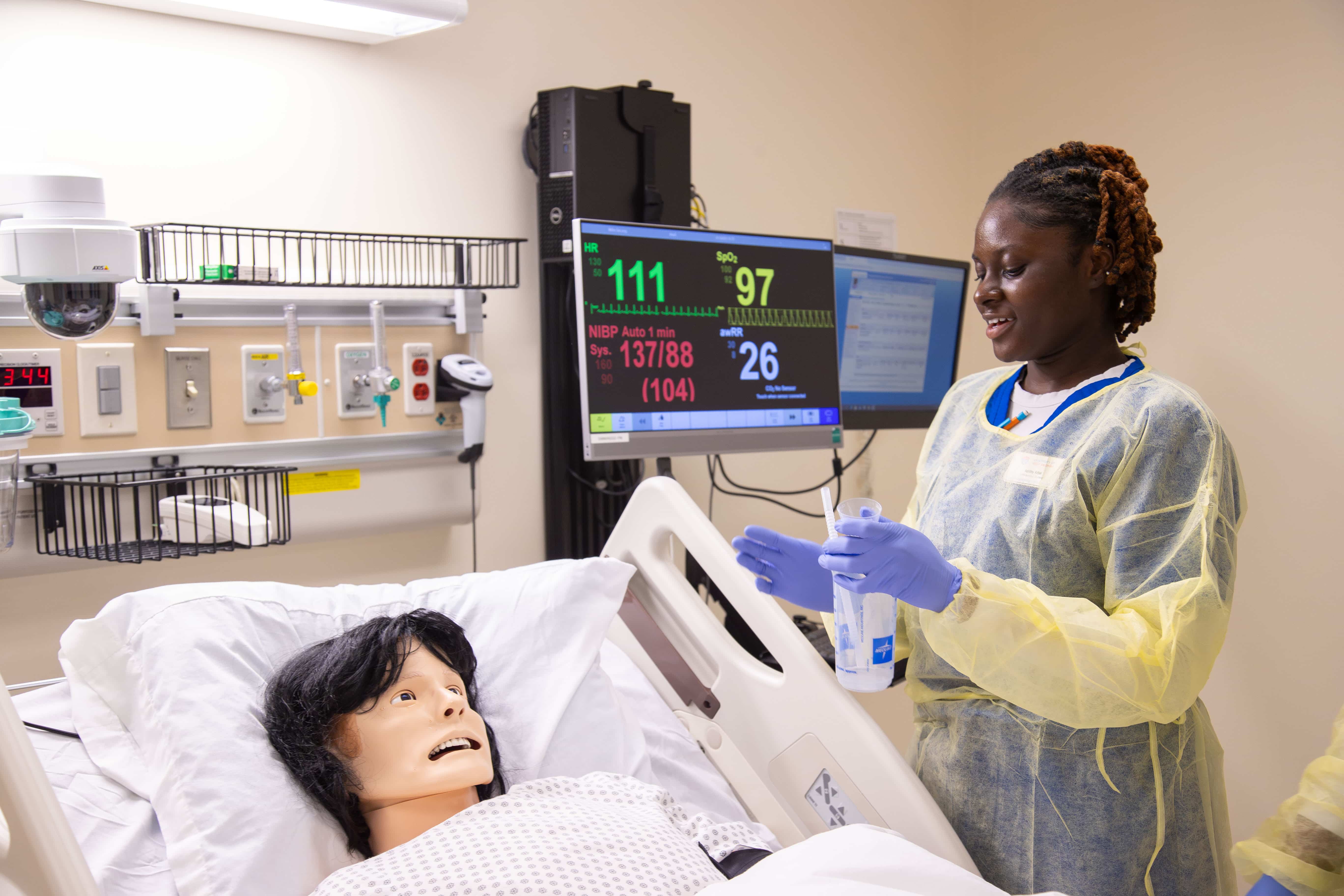 Newnan nursing student interacting in a simulation lab.