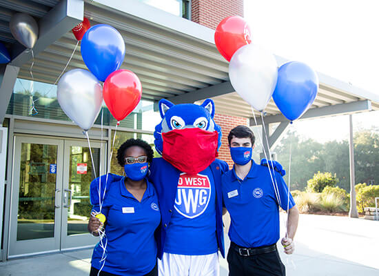 Cherith Moore and Nathan Powell with Wolfie