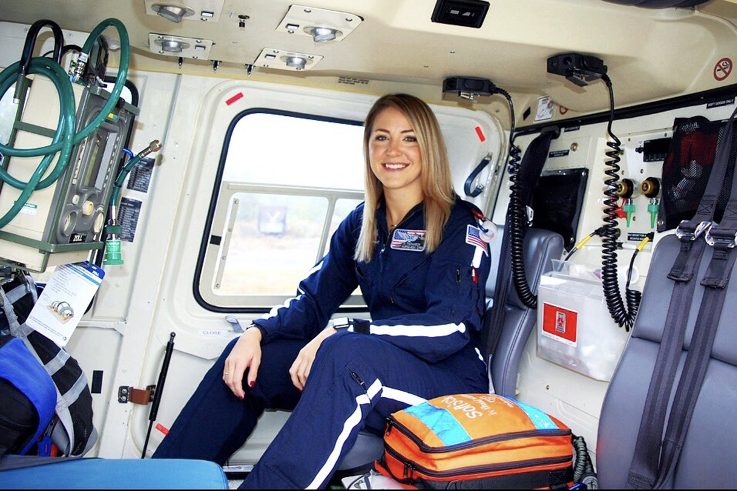 Britta Thomason in a helicopter