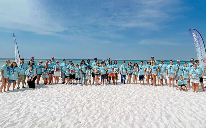 Families gather at a Chace the Victory bereavement retreat at a beach