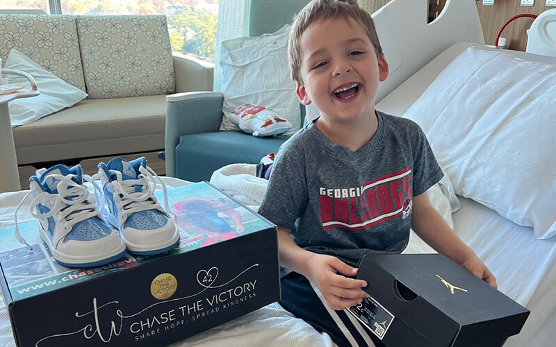 Robbie with his sneakers, provided by CTV.