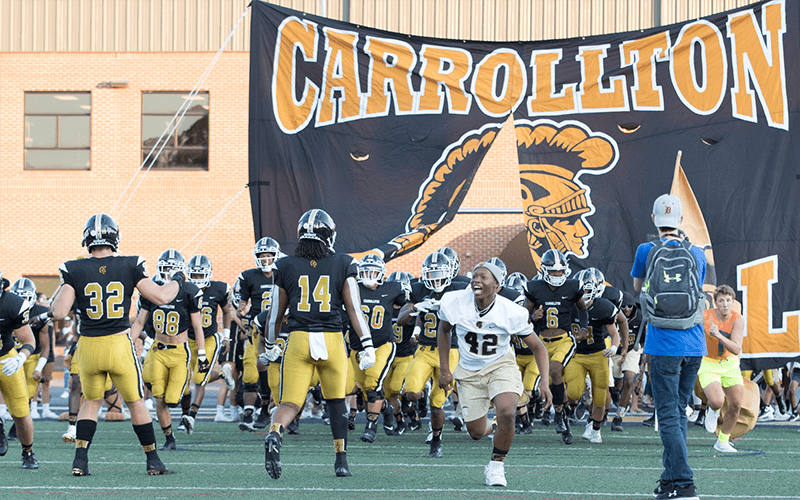Chase celebrates a Carrollton Trojans win