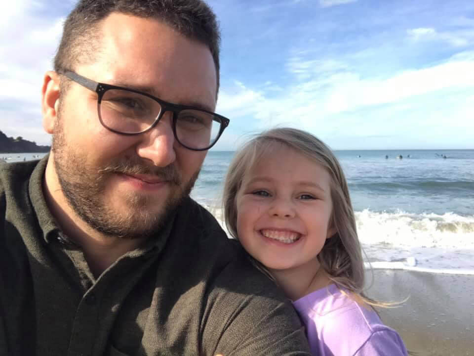 Crittenden with daughter, Evelynn, at the beach in San Francisco where he and his family live