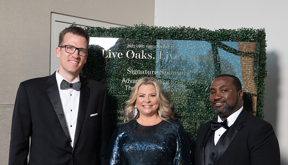 L to R: Dr. Brendan Kelly, UWG president; Christa Pitts; Dr. Chris Johnson, UWG Richards College of Business dean